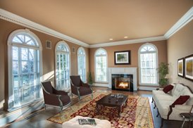 furnished living room, brown interior, fireplace